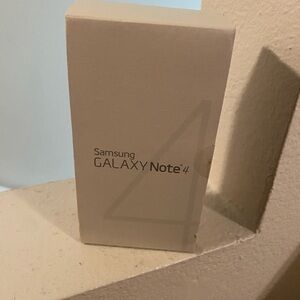 Samsung Galaxy Note 4 Box. Includes Headphones, Sealed.